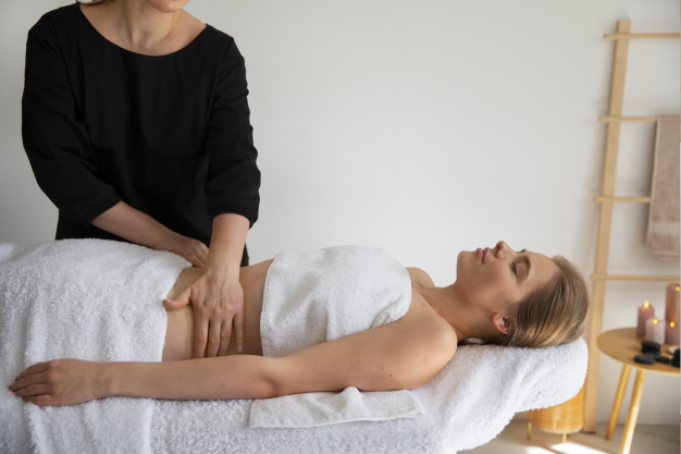 woman massaging another woman